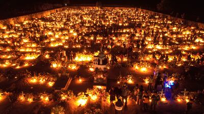Hundreds of families illuminate the graves of their loved ones, in Guerrero state, Mexico. Mexican families once again filled cemeteries with life on the Day of the Dead, on a morning in which they mostly dedicated themselves to cleaning and preparing the cemeteries of their deceased after two years of restrictions due to the COVID-19 pandemic. EPA