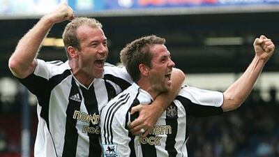 Alan Shearer celebrates a Newcastle goal with Michael Owen in 2005.