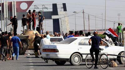 Anti-government protesters block the port of Umm Qasr, south of Basra as Iraqi security forces try to reopen the country's main ports. AP Photo