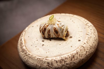 Charred cabbage with sour relish and cashew nuts at Manao. Antonie Robertson / The National