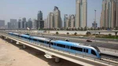 The Dubai Metro taking a test run past Dubai Marina yesterday, a week before its opening on September 9.