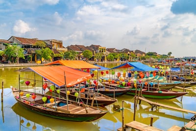 Even more lanterns on the wooden boats on the Thu Bon River in Hoi An. Getty