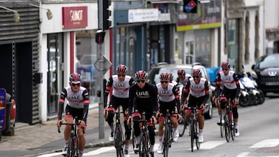 Tadej Pogacar center, rides during a training with teammates in Brest. AP
