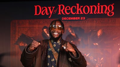 Deontay Wilder poses for a photo as he arrives ahead of the Day of Reckoning fight night. Getty Images