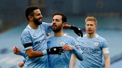 Manchester City's Bernardo Silva celebrates scoring their first goal with Riyad Mahrez. Reuters