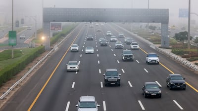Commuters negotiate the tricky conditions on the E11 motorway in Abu Dhabi. Victor Besa / The National