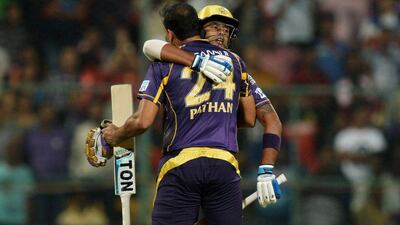 Kolkata Knight Riders batsman Surya Kumar Yadav (R) hugs his partner Yusuf Pathan as they celebrate the team’s victory, during the 2016 Indian Premier League (IPL) Twenty20 cricket match between Royal Challengers Bangalore and Kolkata Knight Riders, at The M Chinnaswamy Stadium in Bangalore on May 2, 2016. AFP / MANJUNATH KIRAN