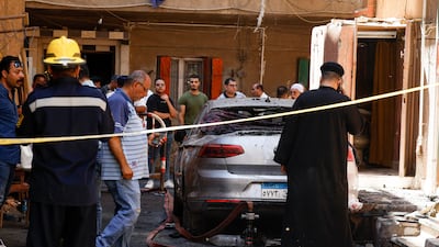 A Coptic priest outside the church in the aftermath of the deadly blaze. AFP