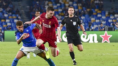 Napoli's Giovanni Di Lorenzo and Liverpool's Andy Robertson in action. EPA