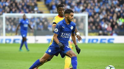 Riyad Mahrez of Leicester City, right, takes the ball past Wilfried Zaha of Crystal Palace. Ross Kinnaird / Getty Images