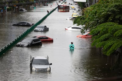 Vehicles submerged by flooding after heavy rain in Bangkok. EPA