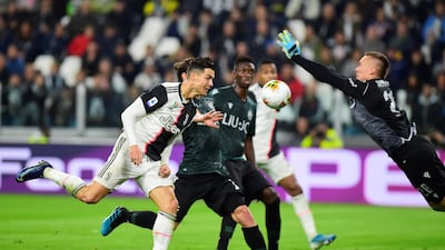 Soccer Football - Serie A - Juventus v Bologna - Allianz Stadium, Turin, Italy Juventus' Cristiano Ronaldo heads at goal. REUTERS