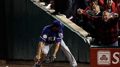 St Louis Cardinals supports cheer as Nelson Cruz, the Texas Rangers right fielder, struggles to deal with a pinch-hit from Allen Craig to allow St Louis the go-ahead run in their 3-2 win to open the World Series.