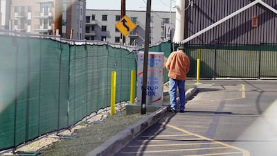 A man drops his ballot into drop box in Phoenix, Arizona. Willy Lowry / The National