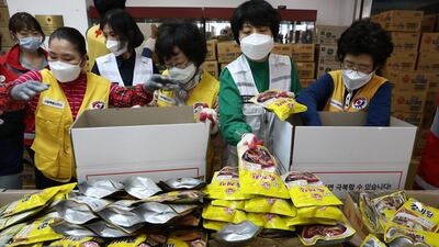 South Korean Red Cross workers prepare emergency relief kits packed with basic necessities for delivery to impoverished people experiencing difficulties amid the spread of coronavirus. Getty Images