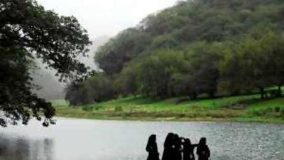 A group of women take in the view at Wadi Darbat in the Dhofar province of Oman.
