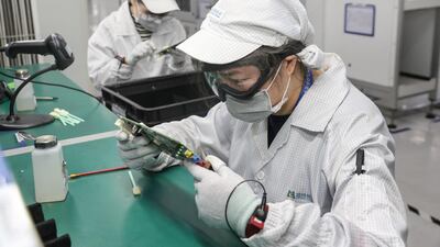 A Chinese employee works at a factory in Nantong in China's eastern Jiangsu province . AFP