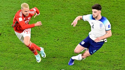 Wales midfielder Aaron Ramsey fights for the ball with England's Declan Rice. AFP