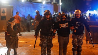 Riot police restrain a protester during a protest in Beirut. Reuters