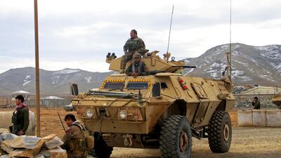 Afghan National Army soldiers keep watch on the outskirts of the main city in Ghazni province a car bomb attack on November 29, 2020. Reuters