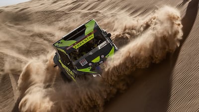 Driver Denis Berezovskiy and co-driver Adrian Torlaschi race their Can-Am during Stage 8 of the Dakar Rally in Saudi Arabia, on Monday, January 13. AP