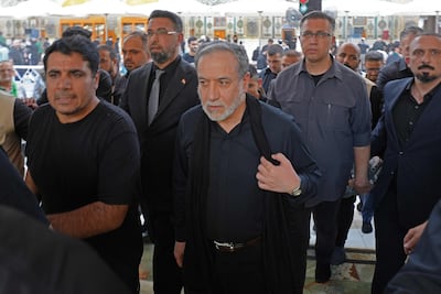 Iranian Foreign Minister Abbas Araghchi, centre, visits a shrine in the Iraqi city of Najaf. AFP