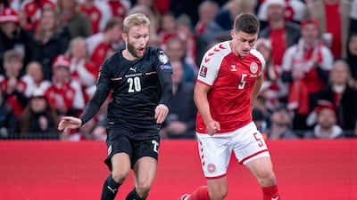 Denmark's Joakim Maehle, right, and Austria's Konrad Laimer battle for the ball. AP