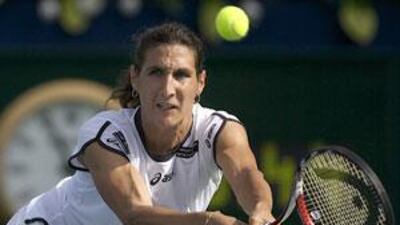 Virginie Razzano returns the ball during her semi-final won over Kaia Kanepi at the BArclays Dubai Tennis Championship.