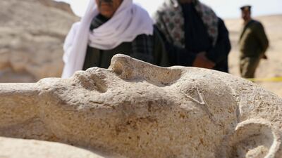 Men secure a stone sarcophagus discovered in an ancient burial site in Minya, Egypt. Mohamed Abd El Ghany / Reuters