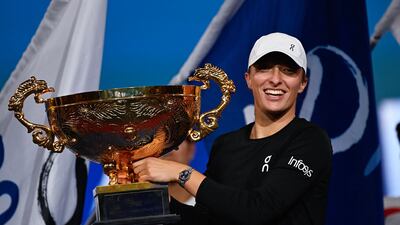 Iga Swiatek poses with the China Open trophy after defeating Liudmila Samsonova in the final. AFP
