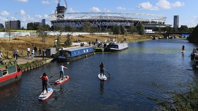 A general view of the London Stadium and surrounding area as a paddle boarders move along the river prior to the Premier League match between West Ham United and Southampton. Shaun Botterill / Getty Images
