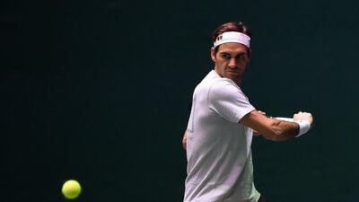 Switzerland's Roger Federer attends a training session during the Paris Masters on Tuesday and says he will compete on Wednesday. AFP