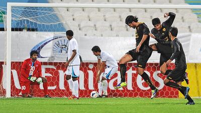 Players of Al Qadsia, right, celebrate following a goal against Baniyas during their Asian Champions League play-off. Abdullateef Al Marzouqi / Al Ittihad