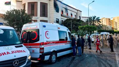 Ambulances, paramedics, and security officers at the scene of an attack outside the Libyan foreign ministry headquarters in the capital Tripoli. AFP