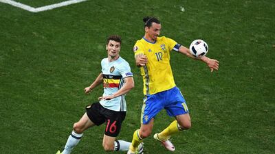 Zlatan Ibrahimovic, right, has retired from international football, but he is a hero to many in his native Sweden. Laurence Griffiths / Getty Images