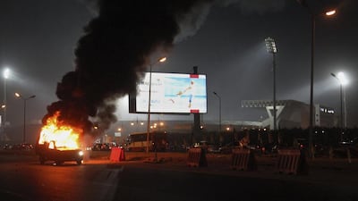 A pick-up truck bursts into flames as a riot breaks. The government accused the football fans of starting the clashes with police, leading to the deaths. Ahmed Abd El Gwad / El Shorouk / AP Photo