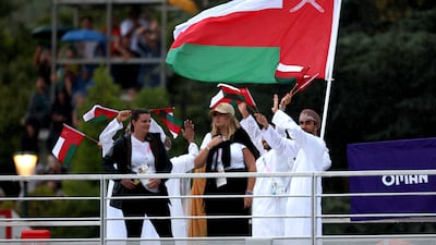 Team Oman are seen waving their flag. Getty Images