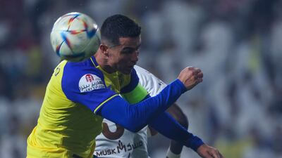 Al Nassr's Portuguese forward Cristiano Ronaldo heads the ball. AFP