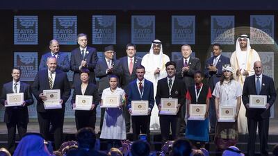 Dignitaries including Sheikh Mohammed bin Zayed, Crown Prince of Abu Dhabi and Deputy Supreme Commander of the Armed Forces, and Dr Sultan Al Jaber, UAE Minister of State and Adnoc Group chief executive, stand with last year's winners of the Zayed Future Energy Prize. Ryan Carter / Crown Prince Court - Abu Dhabi