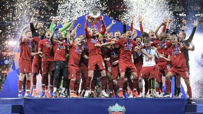 Jordan Henderson of Liverpool lifts the trophy as his side celebrates victory after the Uefa Champions League final between Tottenham Hotspur and Liverpool at Estadio Wanda Metropolitano on June 1, 2019 in Madrid, Spain. Getty