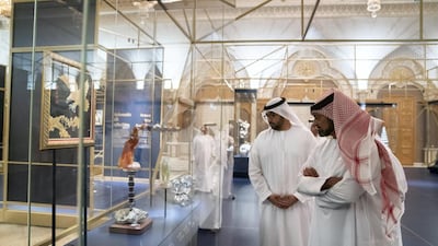 Sheikh Ammar bin Humaid Al Nuaimi, Crown Prince of Ajman, right, and Sheikh Rashid bin Saud Al Mu'alla, Crown Prince of Umm Al Quwain, tour the Presidential Gifts Exhibition, at Qasr Al Watan.