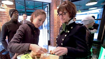 Just Falafel has now 41 restaurants and more than 720 franchise agreements in 19 countries since being started in 2007. Above, customers try out some falafel in Covent Garden in London. Stephen Lock for The National