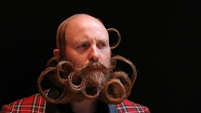 A participant of the international World Beard and Moustache Championships poses before taking part in one of the 17 categories of beard and moustache styles competing in Antwerp, Belgium. Reuters