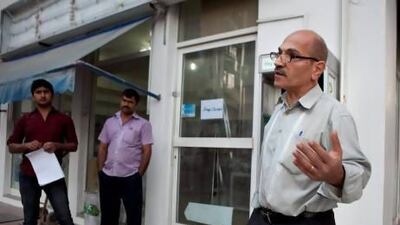 Marwan Yassir from Lebanon standing outside a closed convenience store near Delma Street in Abu Dhabi. Mr. Yassir welcomes the government initiative that ordered the closure of small shops which didn't meet certain standards, saying he trusts the government's decision as it will be beneficial in the long run.
