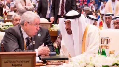 Sheikh Mohammed bin Zayed with Algeria's representative Abdel Qadir bin Saleh at the international donors conference in Kuwait.