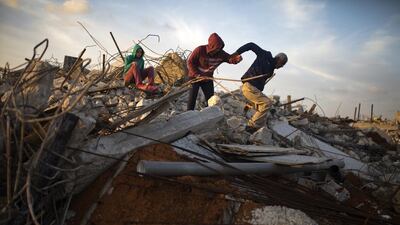Hasounah Makhlouf with some of his family members in the rubble of one of their demolished homes in the Israeli Arab town of Kalansuwa on January 10,2017. The razing of the 11 illegally built houses is one of the biggest demolition operations in the Arab sector in recent years. Heidi Levine for The National