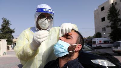 Palestinian medical staff collecting swab samples for Covid-19 testing in the coronavirus section of Dhahria hospital. EPA