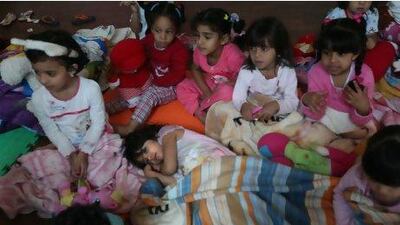 Girls at Al Ain American School prepare for a nap as part of a day showing them the importance of a sleeping routine.