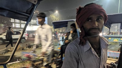 Santosh Yadav, waiting for passengers outside a metro station in New Delhi. Taniya Dutta for The National