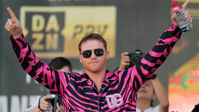 Saul Alvarez motions to the crowd during the weigh-in. AP